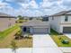 Charming single-story home with a well-manicured lawn and neutral-colored exterior at 3186 Oyster Cove St, Wimauma, FL 33598