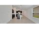 Modern kitchen featuring dark cabinetry, granite countertops, and stainless steel appliances at 3186 Oyster Cove St, Wimauma, FL 33598
