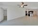 Open-concept space with modern tile, connecting the living area with the contemporary kitchen at 3186 Oyster Cove St, Wimauma, FL 33598