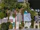 An aerial shot shows the house's layout, positioning, and the large backyard that adds privacy, making it an ideal retreat at 350 Kentucky Ave, Crystal Beach, FL 34681