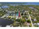 Waterfront home with a private dock, lush trees, and water views at 350 Kentucky Ave, Crystal Beach, FL 34681