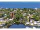 Waterfront home with a private dock, lush trees, and water views at 350 Kentucky Ave, Crystal Beach, FL 34681