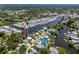 Aerial view of the house in a neighborhood with boating access, offering a unique blend of comfort, convenience, and waterfront living at 350 Kentucky Ave, Crystal Beach, FL 34681