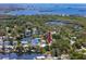 Waterfront home with a private dock, lush trees, and water views at 350 Kentucky Ave, Crystal Beach, FL 34681