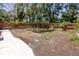 This backyard has a wood fence that provides privacy and the large size allows for endless possibilities and activities at 350 Kentucky Ave, Crystal Beach, FL 34681