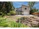 Beautiful backyard with a spiral staircase leading to the deck and a concrete patio that makes a great space for outdoor entertaining at 350 Kentucky Ave, Crystal Beach, FL 34681