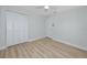 Bedroom featuring a ceiling fan, a closet, and neutral wall paint, creating a serene space at 350 Kentucky Ave, Crystal Beach, FL 34681