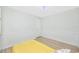 Clean bedroom featuring a ceiling fan and paneled wainscoting at 350 Kentucky Ave, Crystal Beach, FL 34681