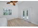 Light, bright bedroom with a vaulted ceiling, light wood floors and french doors to a deck or patio at 350 Kentucky Ave, Crystal Beach, FL 34681
