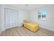 Bright bedroom showcasing shuttered windows, white trim, and hardwood floors at 350 Kentucky Ave, Crystal Beach, FL 34681