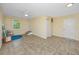 Bonus room featuring neutral-toned walls and tile floors, suitable for recreation or storage at 350 Kentucky Ave, Crystal Beach, FL 34681
