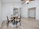 Dining area featuring an open layout with wood floors and white walls at 350 Kentucky Ave, Crystal Beach, FL 34681