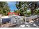 Crystal Beach community center featuring vibrant colors, a welcoming white picket fence and updated landscaping at 350 Kentucky Ave, Crystal Beach, FL 34681