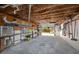 View of a garage with shelving and an open garage door at 350 Kentucky Ave, Crystal Beach, FL 34681