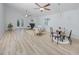 Bright, open-concept living room with vaulted ceilings, fireplace and light wood flooring at 350 Kentucky Ave, Crystal Beach, FL 34681
