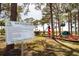 Community playground featuring equipment, signage, and shaded areas in Palm Harbor at 350 Kentucky Ave, Crystal Beach, FL 34681