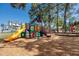 Gathering-friendly community playground with slides, climbing features and mature trees at 350 Kentucky Ave, Crystal Beach, FL 34681