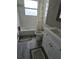 A compact bathroom with a white vanity and a bathtub with floral curtain at 3614 E Grove St, Tampa, FL 33610