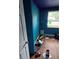This bedroom features sleek wood-look flooring, a window, and a closet at 3614 E Grove St, Tampa, FL 33610