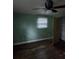 View of a bedroom featuring a ceiling fan, a closet, and a window with blinds at 3614 E Grove St, Tampa, FL 33610