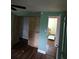 A bedroom featuring wood-look flooring and a closet at 3614 E Grove St, Tampa, FL 33610