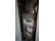 A damaged and old HVAC unit in a confined space, needs replacement at 3614 E Grove St, Tampa, FL 33610