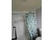 Shower features white tiling with decorative accent tile, along with modern fixtures at 3614 E Grove St, Tampa, FL 33610