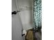 Shower features white tiling with decorative accent tile, along with modern fixtures at 3614 E Grove St, Tampa, FL 33610