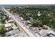 The home is visible amongst a mix of residential and commercial properties, with a major road nearby at 3632 E Comanche Ave, Tampa, FL 33610