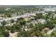 Aerial view of property in a suburban area with mature trees, conveniently located near shopping areas at 3632 E Comanche Ave, Tampa, FL 33610