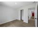 Bedroom showcasing wood-look flooring, closet and door at 3632 E Comanche Ave, Tampa, FL 33610