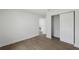 Bedroom showcasing wood-look flooring, closet and neutral paint at 3632 E Comanche Ave, Tampa, FL 33610