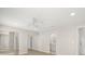 Bedroom includes mirrored closet doors, recessed lighting, and access to an attached bathroom at 4016 Windtree Dr, Tampa, FL 33624