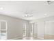 Bedroom includes mirrored closet doors, two windows overlooking the pool, and hardwood floors at 4016 Windtree Dr, Tampa, FL 33624