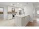 Modern kitchen with white cabinets, stainless steel appliances, and island at 4016 Windtree Dr, Tampa, FL 33624