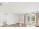Hardwood floors, recessed lighting, and access to the pool through sliding glass doors are featured in this living room at 4016 Windtree Dr, Tampa, FL 33624