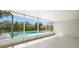 Enclosed back patio with in-ground swimming pool at 4016 Windtree Dr, Tampa, FL 33624