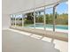 Enclosed back patio features a swimming pool and privacy fence at 4016 Windtree Dr, Tampa, FL 33624