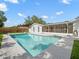 Backyard with pool, fencing and privacy landscaping at 4016 Windtree Dr, Tampa, FL 33624
