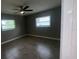 Bedroom featuring tile floors, a ceiling fan, and two windows providing natural light at 4374 32Nd N Ter, St Petersburg, FL 33713