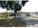Charming single-story home featuring an attached garage and well-lit exterior at 4374 32Nd N Ter, St Petersburg, FL 33713