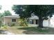 Inviting single-story home with landscaped front yard and mature tree at 4374 32Nd N Ter, St Petersburg, FL 33713