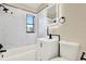 Bathroom featuring a tub, a shower, and modern fixtures at 4379 Porpoise Se Dr, St Petersburg, FL 33705