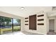 Bright bedroom with large window offering views of the outside at 4379 Porpoise Se Dr, St Petersburg, FL 33705