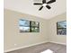 Bright bedroom with two windows and gray laminate flooring at 4379 Porpoise Se Dr, St Petersburg, FL 33705
