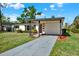 Charming single-story home featuring a carport, landscaped yard and a freshly painted exterior at 4379 Porpoise Se Dr, St Petersburg, FL 33705