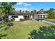 Well-maintained single-story home with mature landscaping and a covered entryway at 4379 Porpoise Se Dr, St Petersburg, FL 33705