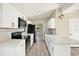 Bright, modern kitchen with white cabinets, stainless steel appliances, and sleek countertops at 4379 Porpoise Se Dr, St Petersburg, FL 33705