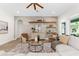 Cozy living room showcases a decorative wall, ceiling fan, and ample natural light for a welcoming atmosphere at 4383 Ortona Ln, Wesley Chapel, FL 33543