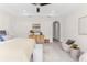 Spacious main bedroom featuring a decorative ceiling, recessed lighting, and stylish furnishings at 4383 Ortona Ln, Wesley Chapel, FL 33543
